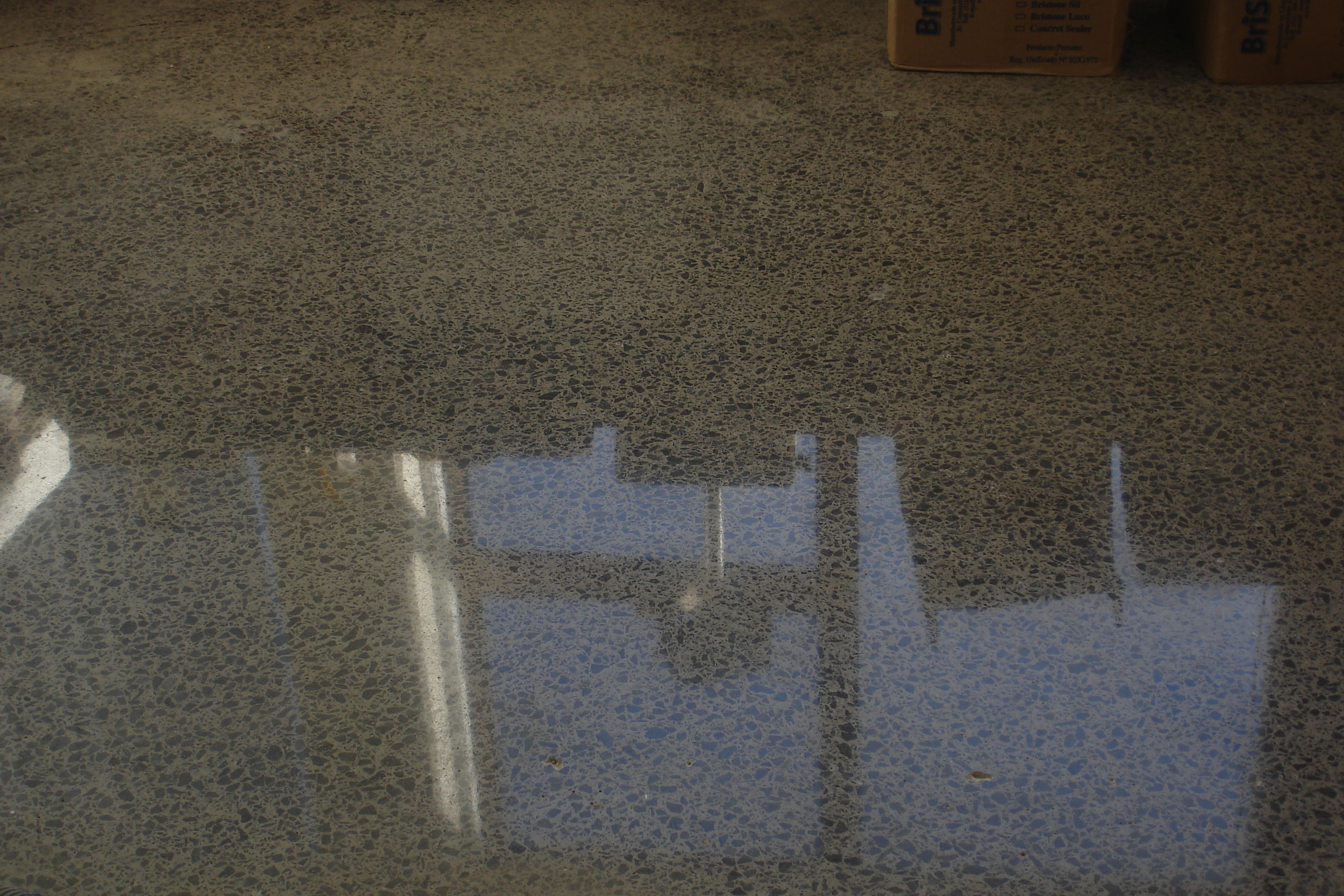 BriStone on honed and polished concrete, high traffic area and installed for over a year with no cleaning.